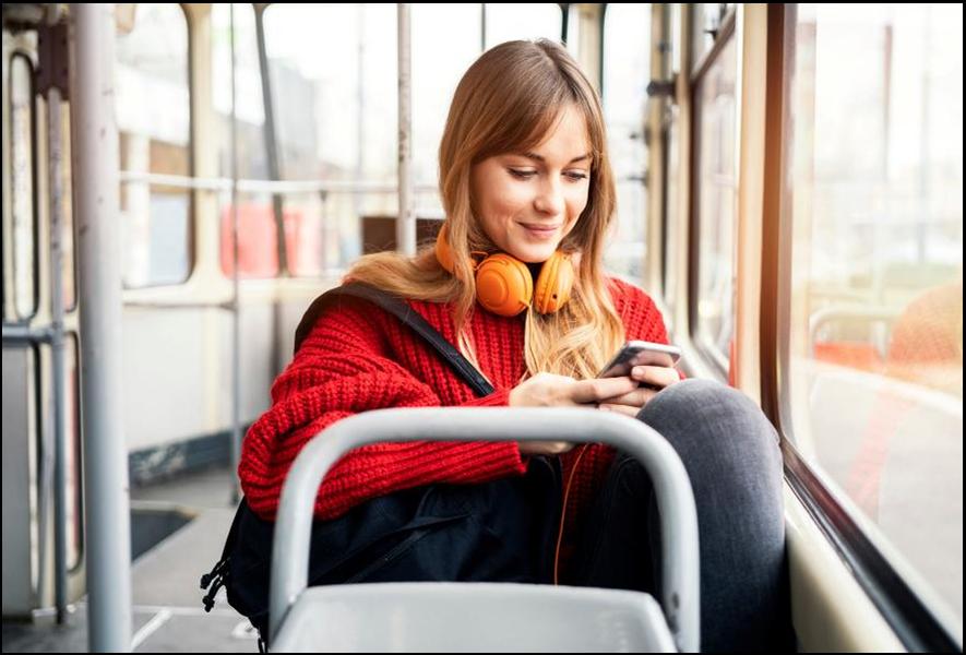 Young woman riding in public transportation